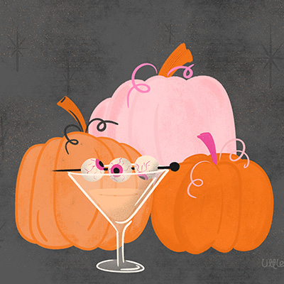 halloween still life pumpkins in pink and orange and spooky martini with eye balls